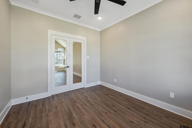 empty room with dark wood-type flooring, ceiling fan, french doors, and ornamental molding