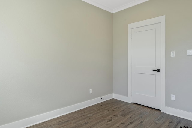 empty room with dark hardwood / wood-style flooring