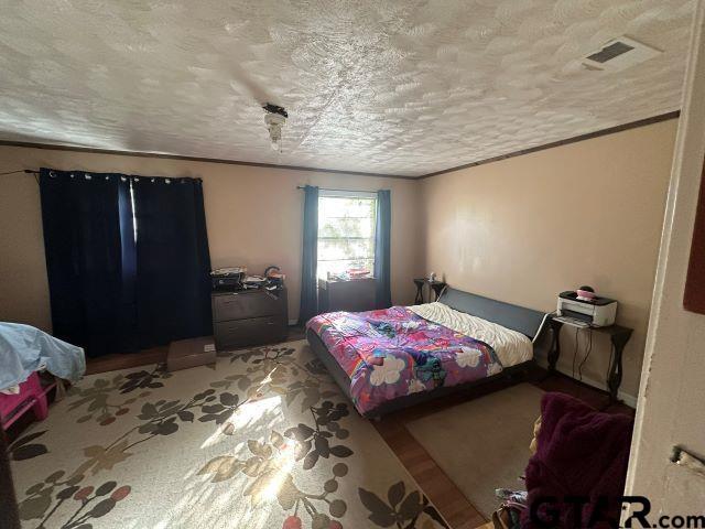 bedroom with a textured ceiling