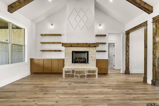 11905 Tara Ln, Lindale, TX 75771 - unfurnished living room featuring high vaulted ceiling, recessed lighting, light wood-type flooring, baseboards, and beamed ceiling