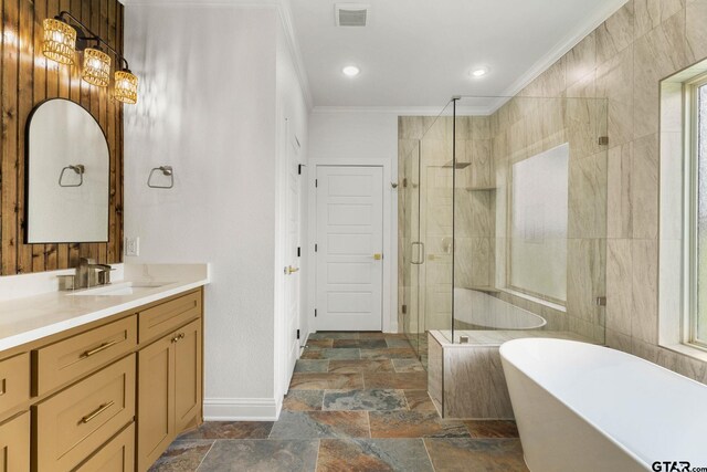 11905 Tara Ln, Lindale, TX 75771 - bathroom with crown molding, vanity, a soaking tub, stone tile floors, and a stall shower