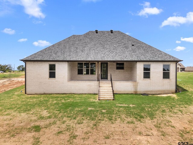 11905 Tara Ln, Lindale, TX 75771 - back of property with roof with shingles, brick siding, and a yard
