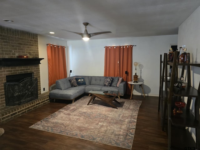 115 Pearson Ln, Longview, TX 75604 - living room with dark wood-style flooring, a ceiling fan, a fireplace, and recessed lighting