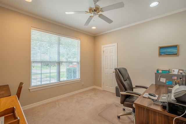 carpeted home office with plenty of natural light, ceiling fan, and ornamental molding