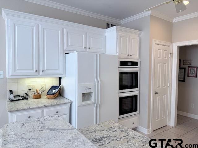 kitchen with white cabinetry, white refrigerator with ice dispenser, backsplash, and double oven