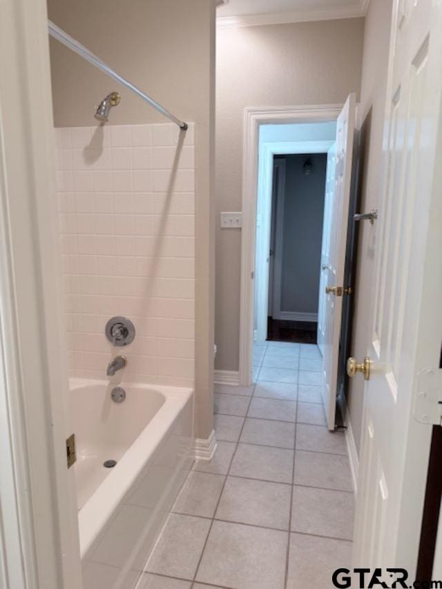 bathroom with tile patterned floors and shower / washtub combination