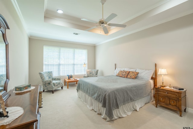 bedroom featuring a raised ceiling, ceiling fan, light colored carpet, and crown molding