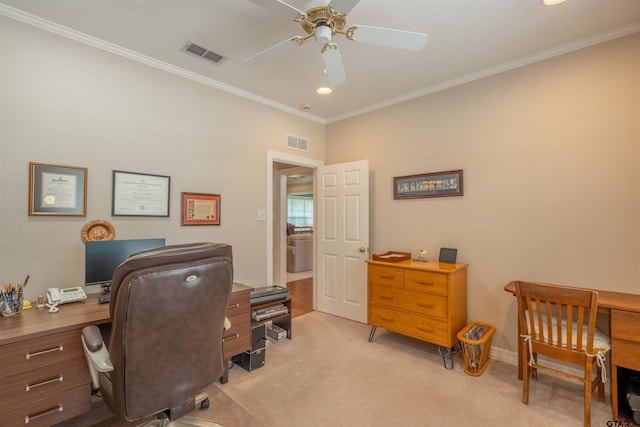 carpeted home office with ceiling fan and ornamental molding