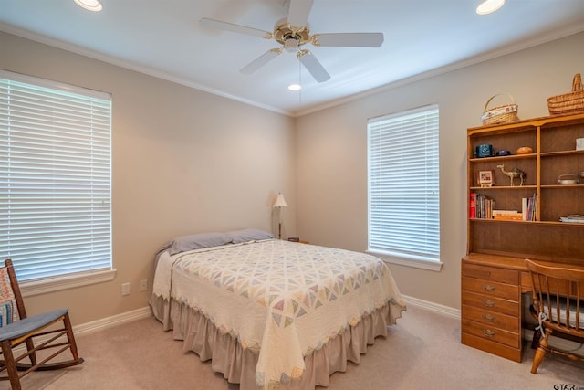 bedroom featuring ceiling fan, crown molding, and light carpet