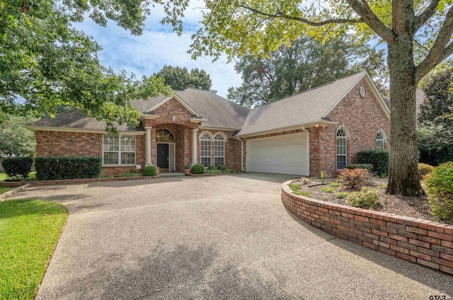 ranch-style house featuring a garage