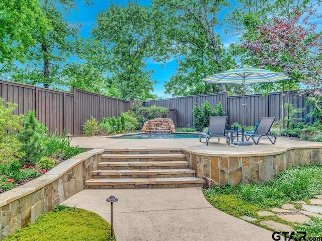 view of patio featuring a fenced in pool and a fenced backyard