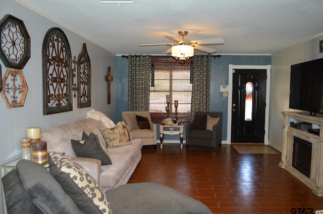 living room featuring ceiling fan and dark hardwood / wood-style flooring