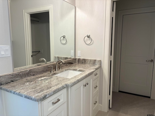 bathroom with vanity and tile patterned floors