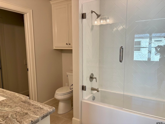 full bathroom featuring shower / bath combination with glass door, tile patterned floors, toilet, and vanity