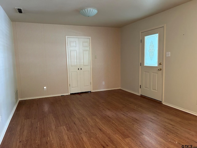 foyer with dark hardwood / wood-style flooring