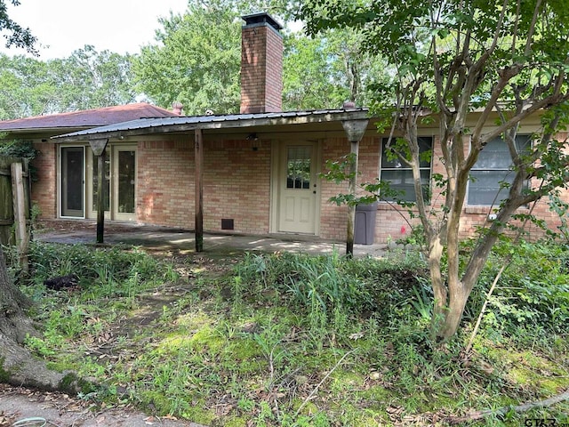 back of house with a patio area