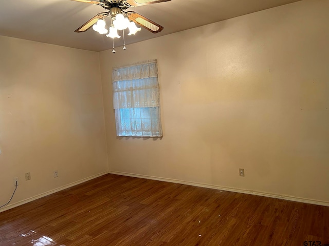 unfurnished room featuring hardwood / wood-style flooring and ceiling fan