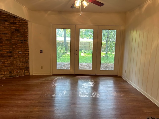 entryway featuring french doors, dark hardwood / wood-style flooring, and crown molding