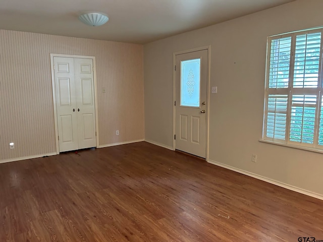 foyer with dark hardwood / wood-style floors