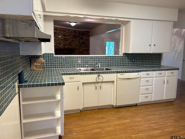 kitchen featuring dishwasher, light hardwood / wood-style flooring, white cabinetry, and sink