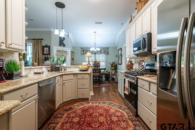 kitchen with stainless steel appliances, dark hardwood / wood-style flooring, kitchen peninsula, a chandelier, and pendant lighting