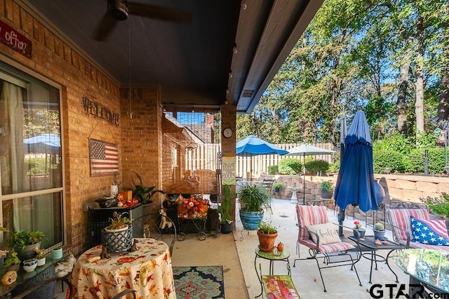 view of patio / terrace featuring ceiling fan