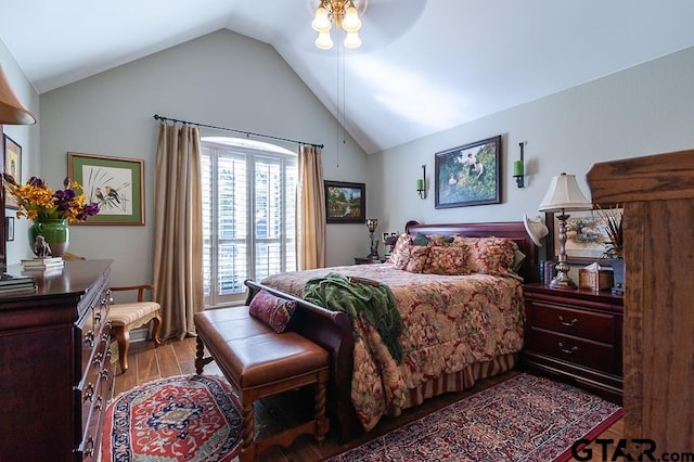 bedroom with light wood-type flooring, vaulted ceiling, and ceiling fan