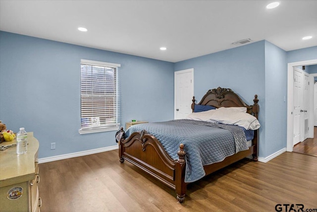 107 W Nutbush, Tyler, TX 75702 - bedroom featuring wood finished floors and recessed lighting