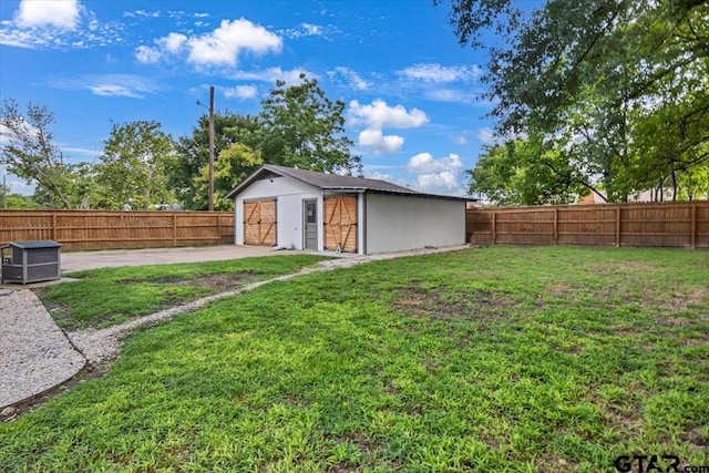 107 W Nutbush, Tyler, TX 75702 - fenced backyard with a detached garage and an outbuilding
