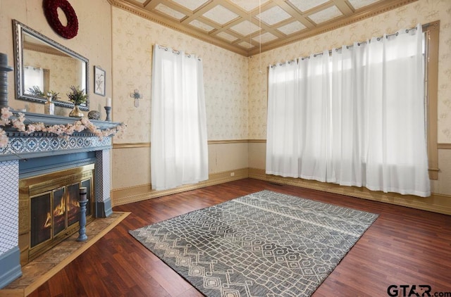 sitting room featuring a healthy amount of sunlight, a fireplace, dark wood-type flooring, and coffered ceiling