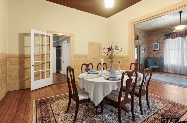 dining area with french doors and hardwood / wood-style flooring