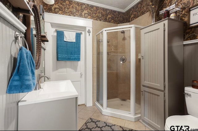 bathroom featuring vanity, tile patterned floors, and a shower with door