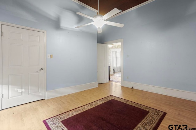 spare room featuring wood-type flooring and ceiling fan