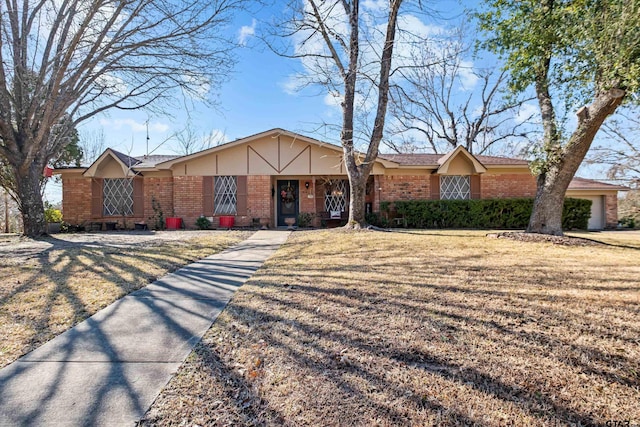 ranch-style home featuring a front yard