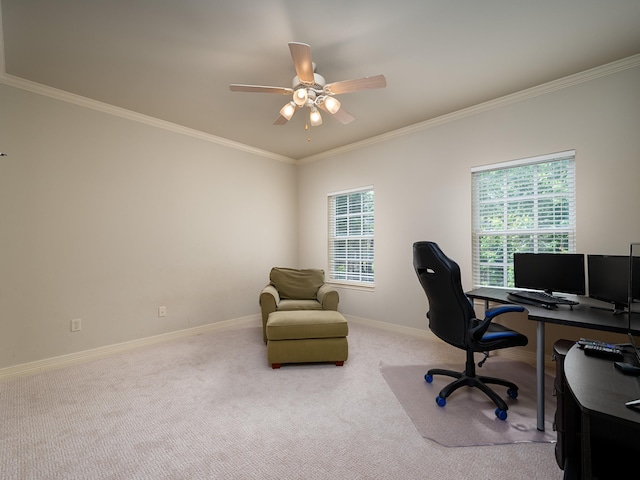 office area featuring baseboards, ornamental molding, a ceiling fan, and carpet floors