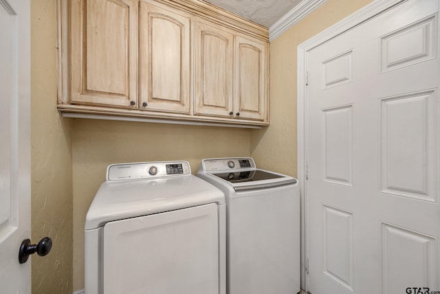 washroom featuring cabinets, independent washer and dryer, ornamental molding, and a textured ceiling