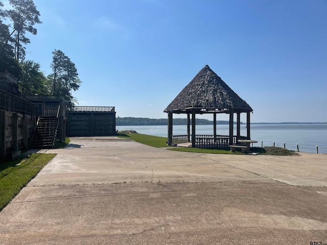 exterior space with a water view and a gazebo