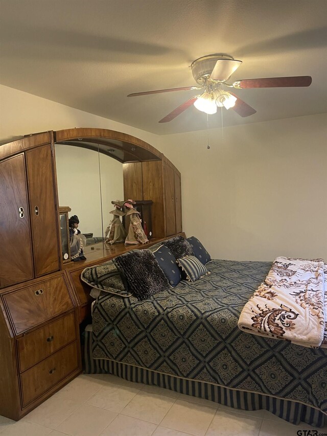 464 Forest Hills Dr, Livingston, TX 77351 - bedroom with light tile patterned flooring and ceiling fan