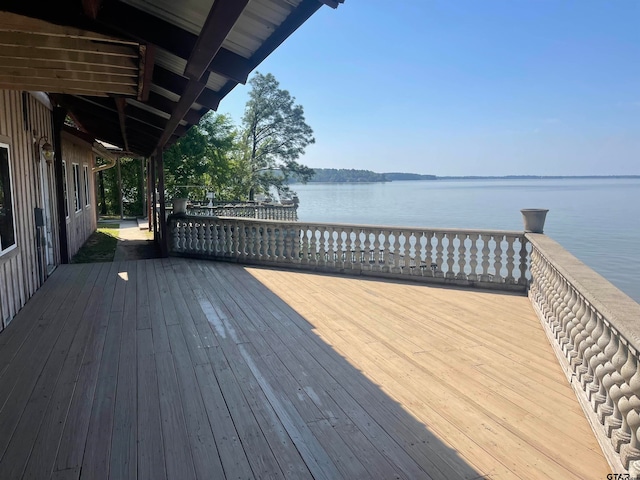 wooden terrace with a water view