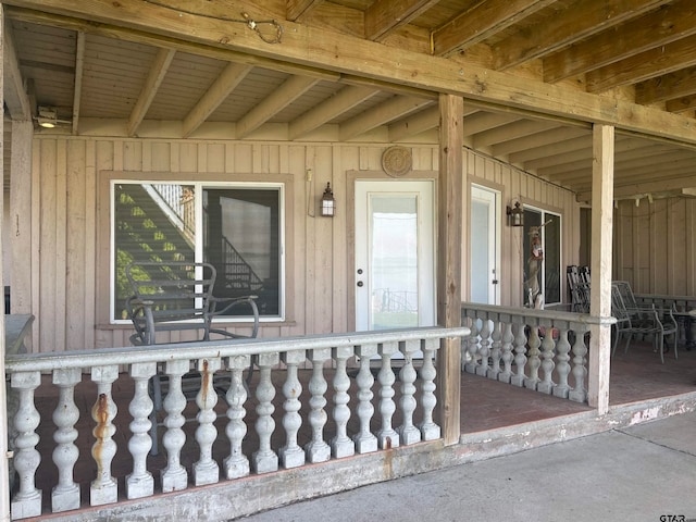 property entrance featuring covered porch