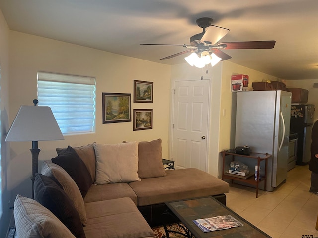 tiled living room with ceiling fan