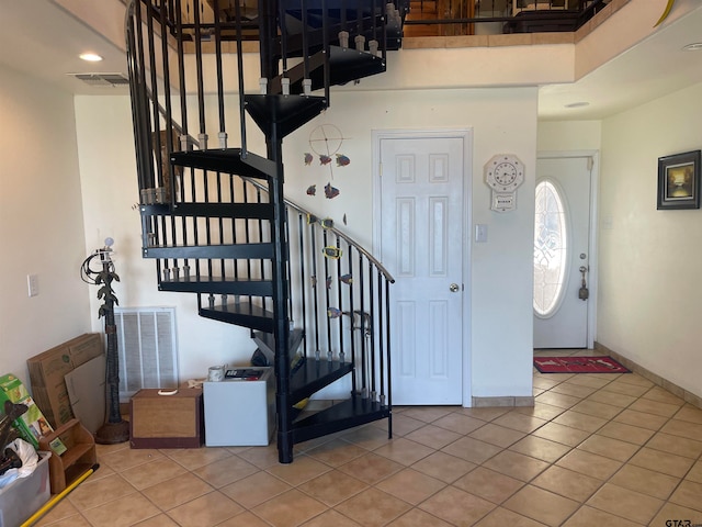 staircase with tile patterned flooring