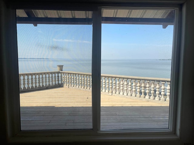 wooden terrace with a water view