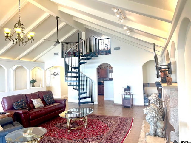 tiled living room featuring beamed ceiling, ceiling fan with notable chandelier, and high vaulted ceiling