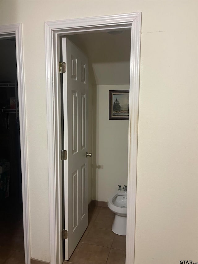 bathroom with tile patterned floors