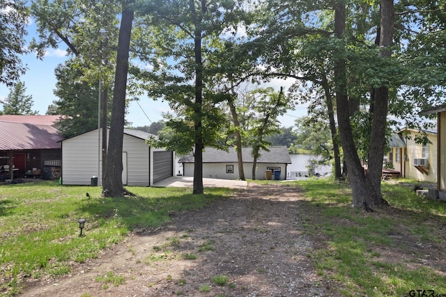 view of yard featuring cooling unit and an outdoor structure