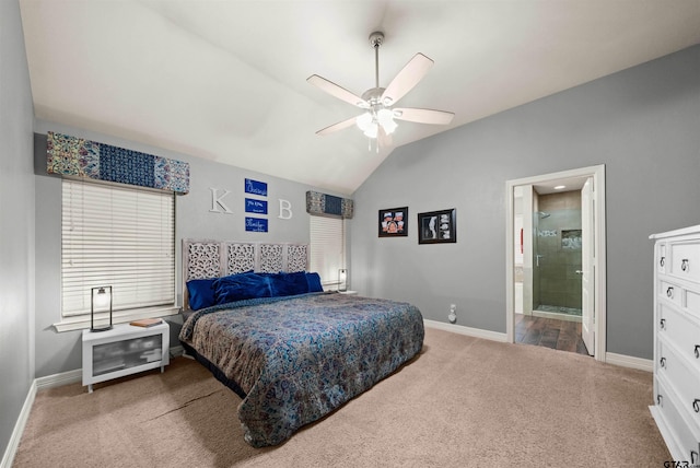 bedroom with ceiling fan, ensuite bath, lofted ceiling, and carpet floors