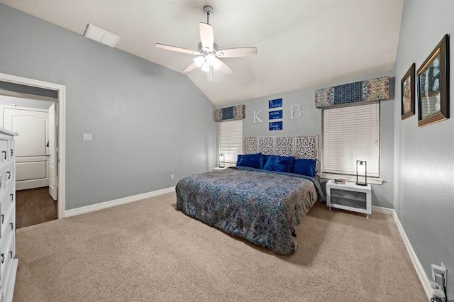 bedroom featuring carpet, vaulted ceiling, and ceiling fan