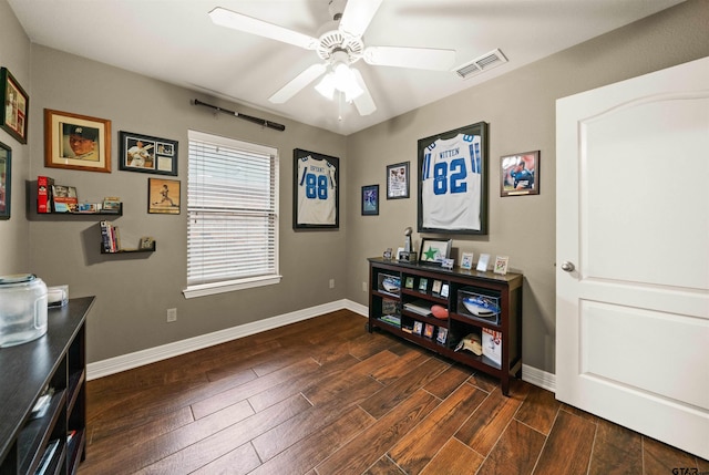 misc room featuring ceiling fan and dark hardwood / wood-style floors