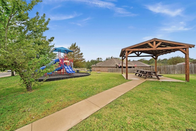 exterior space with a playground, a patio, and a gazebo